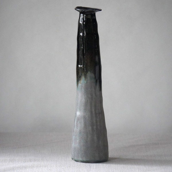 Tall handbuilt ceramic pottery vase with dark black, speckled with gold flecks and  matte white glaze. Rustic and earthy, contemporary.