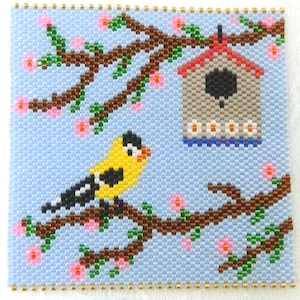 May include: A beaded square featuring a yellow and black bird perched on a brown branch with pink flowers. A birdhouse with a red roof is in the background. The background is light blue, and the border is gold.