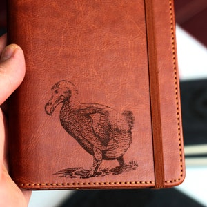 Customizable engraved extinct bird dodo zoological illustration journal leather bound, strip with the same color to keep it