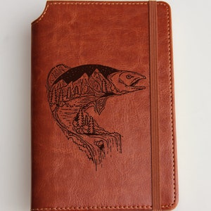 Custom designed Double exposure fish forest water fall Journal laser engraved with personalized  text leather bound elastic strip.