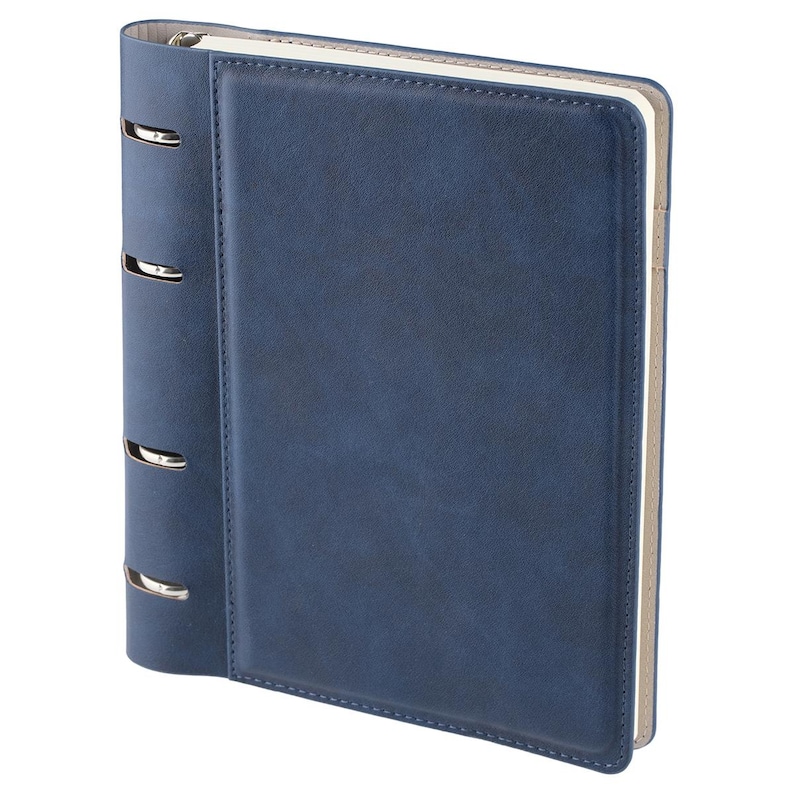May include: A navy blue binder with a smooth, leather-like finish and stitched edges. The spine features four silver-colored metal rings visible through cutouts. The interior contains white paper pages, and the cover has a rectangular panel design.