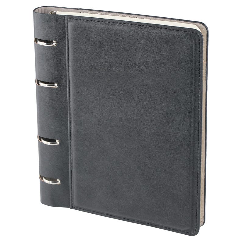 May include: A dark charcoal gray binder with a smooth, matte finish and a rectangular stitched border on the front cover. The spine features four silver-toned metal rings exposed along the side, with a light beige interior lining visible.
