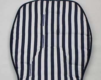 May include: A white and navy blue striped stroller seat liner. The liner has a padded design and is made of a soft, comfortable fabric.
