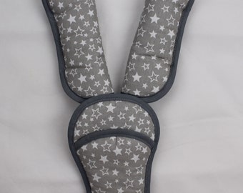 May include: Gray and white star patterned padded straps for a car seat or stroller.