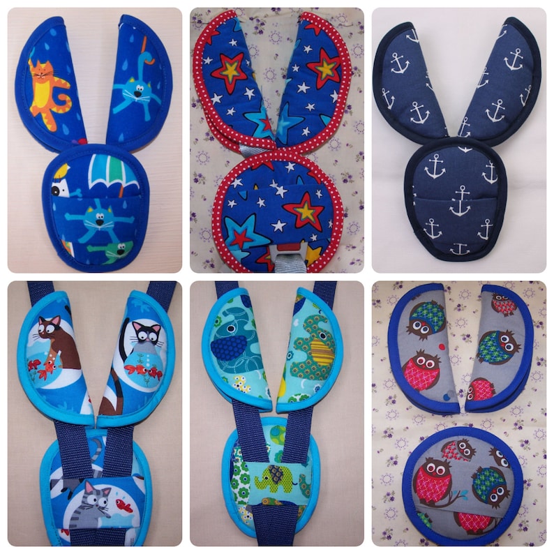 May include: A collection of six sets of padded harness strap covers and chest clips for car seats or strollers. The fabric designs include cats, stars, anchors, fish, elephants, and owls in various colors like blue, grey, and red.