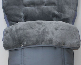 May include: Gray stroller liner with a soft, plush lining. The liner has a quilted exterior and a zippered opening.