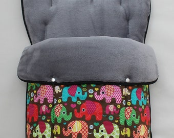 May include: A gray and black stroller liner with a brown background and colorful elephant print. The liner has a soft, plush lining and a zipper closure.