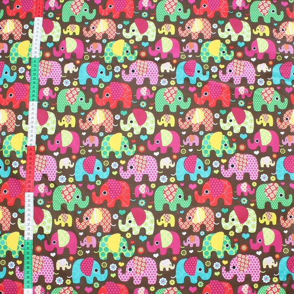 Cotton Fabfric “elephants  on a brown”