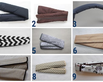 May include: A collection of nine different stroller accessories, including handlebar covers and seat belt pads. The items feature various patterns and colors, such as navy blue, brown, black and white chevron, floral, polka dots, and a woodland design.