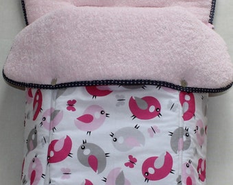May include: A pink and white baby stroller liner with a bird and butterfly pattern. The liner has a soft, plush pink lining and a zipper closure.