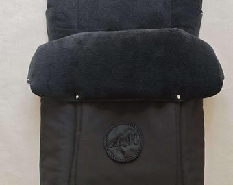 May include: Black stroller liner with a fleece lining and a logo that says "A&M".