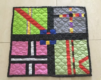 Quilted  modern scalloped colorful hand pieced design ,wall hanging with sleeve on the back for dowel