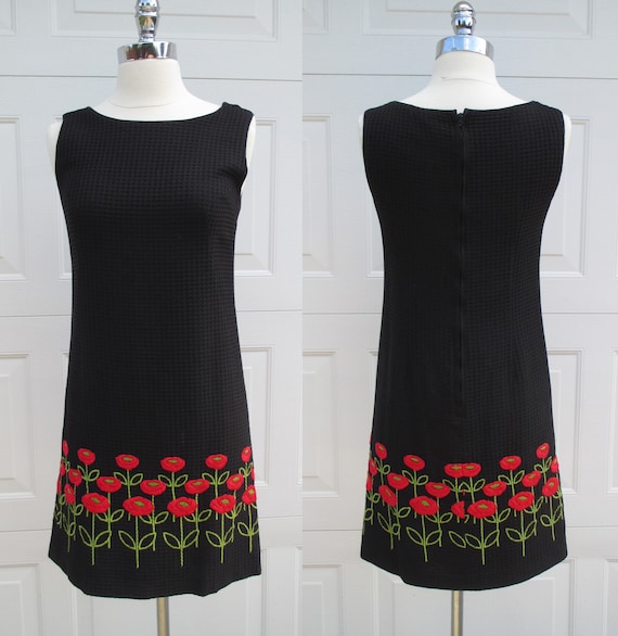 black dress with red embroidered flowers
