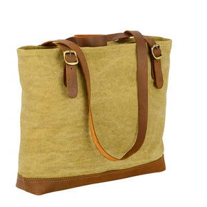 Authentic Leather Canvas tote bag. 100% hand crafted and fitted with solid brass accessories.