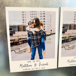 May include: Save the date card with a photo of a couple in an urban setting. The text reads "Save the Date Matthew & Sirrah Seabrook, WA | May 6, 2023".