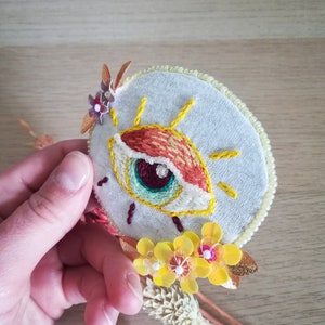 Yellow and orange eye, hand embroidery brooch with sequins and beads. image 3