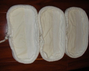 May include: Three white microfiber mop pads with a sewn seam down the center. The pads are designed to fit a standard mop.