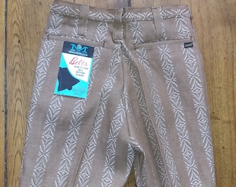 May include: Brown pants with a white geometric pattern. The pants have a label that reads "Maverick Bells Slim Fitting Bell Bottom Slacks".