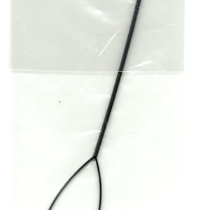 May include: A black plastic hair tool with a loop at the top and a pointed end. The tool is designed to help with hair extensions.