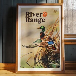 May include: A framed vintage poster with a green and brown mallard duck in flight. The poster has the text "River & Range" and "35¢" printed on it.