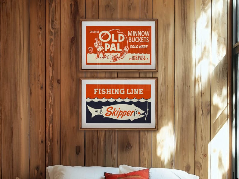 May include: Two framed vintage fishing-themed posters. The top poster reads "Old Pal Minnow Buckets Sold Here." The bottom poster says "Fishing Line Skipper." Both posters have a retro design with red, white, and blue colors.