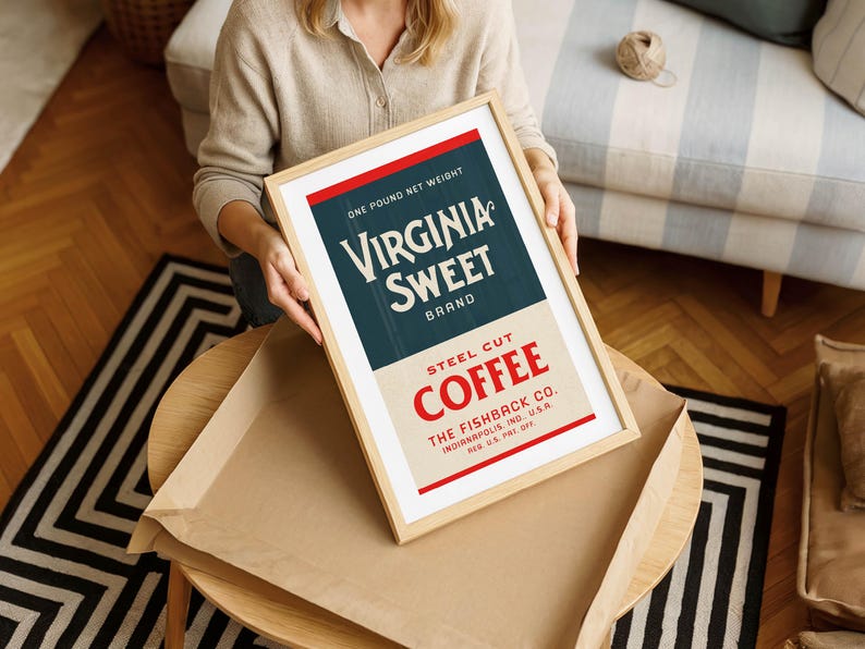 May include: A framed vintage advertisement for Virginia Sweet Brand Steel Cut Coffee. The design features a red and blue color scheme with the text "Virginia Sweet Brand" prominently displayed. The frame is light-colored wood.