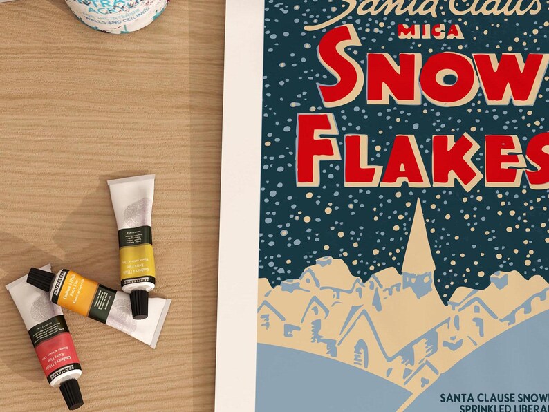 May include: Vintage style illustration of a snowy winter scene with a blue background and white snow. The text "Santa Claus Mica Snowflakes" is in red and white lettering. The text "Sprinkled Liberally" is in black lettering.