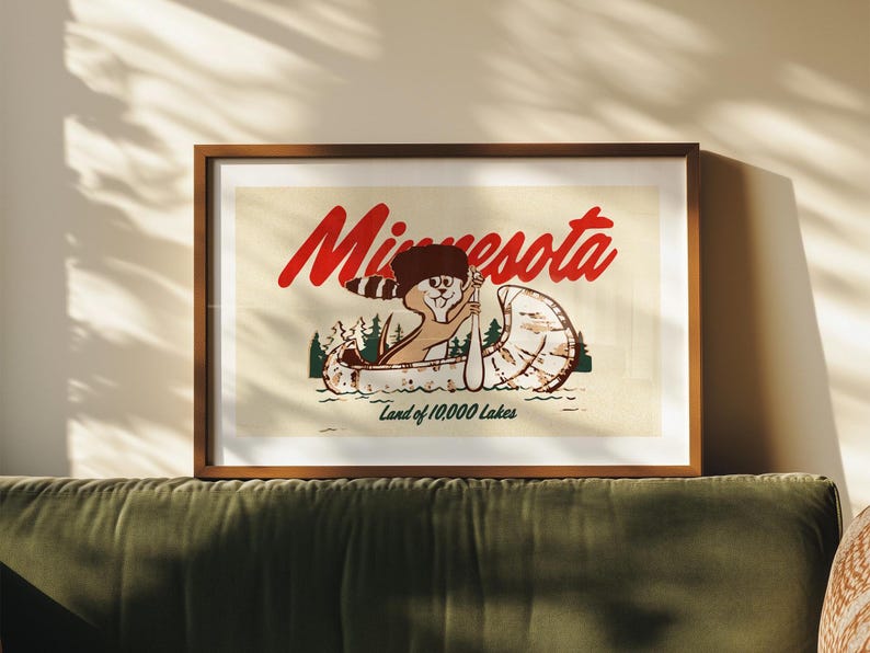 May include: A vintage-style illustration of a cartoon beaver paddling a canoe with the text "Minnesota Land of 10,000 Lakes" printed below.