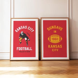 May include: Two framed prints with red backgrounds and yellow text. The left print features a football player in a black and white uniform with the text "Kansas City Football Tradition 1960". The right print features a yellow football with the text "Sundays in 1960 Kansas City".