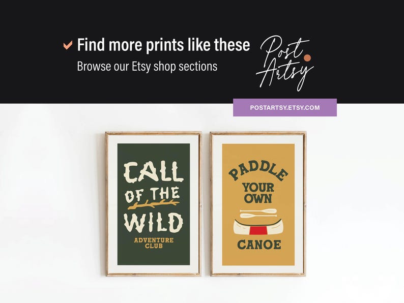 May include: Two framed art prints with outdoor adventure themes. One features "Call of the Wild" text on a dark green background. The other says "Paddle Your Own Canoe" on a mustard yellow background. The prints are in wooden frames.