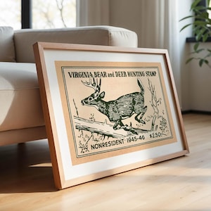 May include: Framed vintage print of a deer leaping over a log, with the text "VIRGINIA BEAR and DEER HUNTING STAMP" and "NONRESIDENT 1945-46". The artwork is in shades of green and brown, set in a light wood frame.
