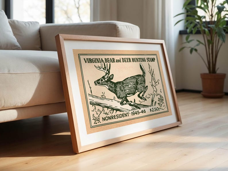 May include: Framed vintage print of a deer leaping over a log, with the text "VIRGINIA BEAR and DEER HUNTING STAMP" and "NONRESIDENT 1945-46". The artwork is in shades of green and brown, set in a light wood frame.