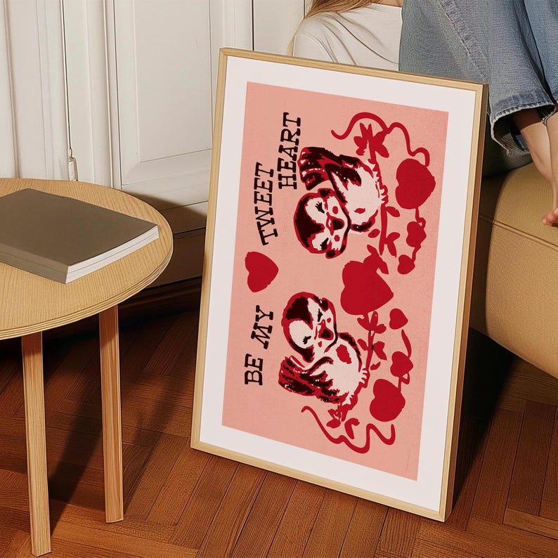 May include: A pink framed print with a red and white illustration of two birds with the text "Be My Tweet Heart" on a pink background.