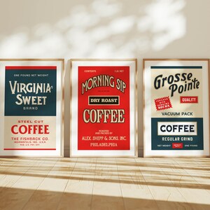May include: Three framed vintage coffee advertisements. The first reads "Virginia Sweet Coffee" in navy and red. The second reads "Morning Sip Dry Roast Coffee" in red. The third reads "Grosse Pointe Coffee" in cream and navy.