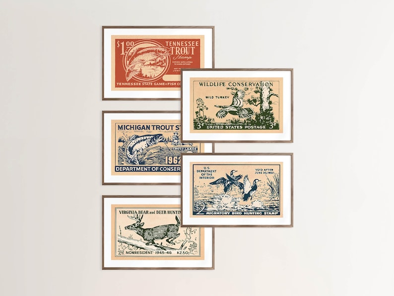 May include: A set of framed vintage hunting and fishing stamps. The stamps depict illustrations of a trout, wild turkey, deer, and ducks. The colour scheme includes shades of red, green, blue, and brown.