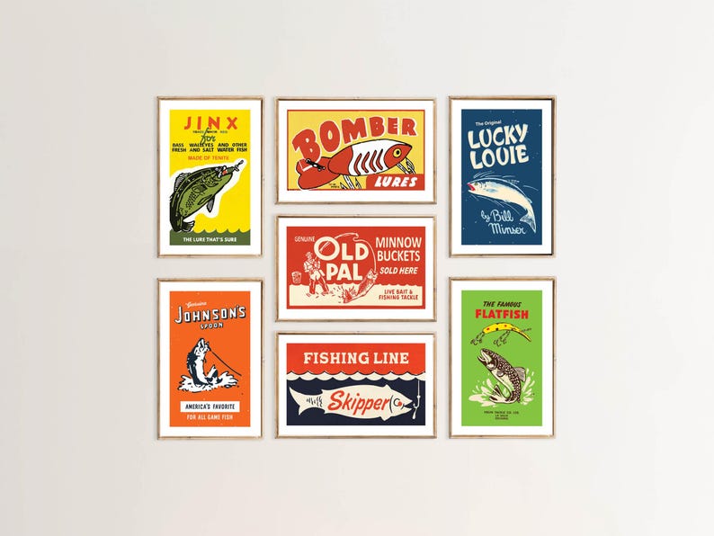 May include: A collection of framed vintage fishing-themed prints. Each print features bold colors and retro graphics, including illustrations of fish, lures, and text such as "Jinx", "Bomber Lures", and "Lucky Louie".