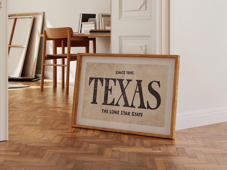 May include: A framed print with a vintage aesthetic featuring the word "TEXAS" in bold black letters. The text "Since 1845" and "The Lone Star State" are also included in the print.