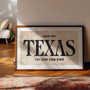 May include: A framed print with a vintage aesthetic featuring the text "Since 1845 Texas The Lone Star State" in black lettering on a beige background.