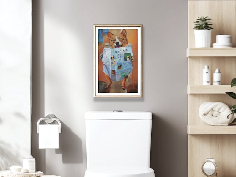 Puede incluir: Una pintura enmarcada de un perro corgi sentado en un inodoro y leyendo un peri&oacute;dico titulado "Canine Daily Dog Catcher Daily".