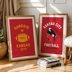 May include: Two framed posters with red backgrounds and gold lettering. The poster on the left says "Sundays in 1960 Kansas City" with a football graphic. The poster on the right says "Kansas City 1960 Football Tradition" with a football player graphic.