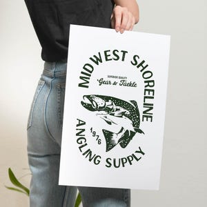 May include: A white poster with a green circle logo that says "Midwest Shoreline Angling Supply" with a black and white illustration of a fish inside the circle. The text "Superior Quality Gear & Tackle" is inside the circle above the fish. The year "1976" is below the fish.