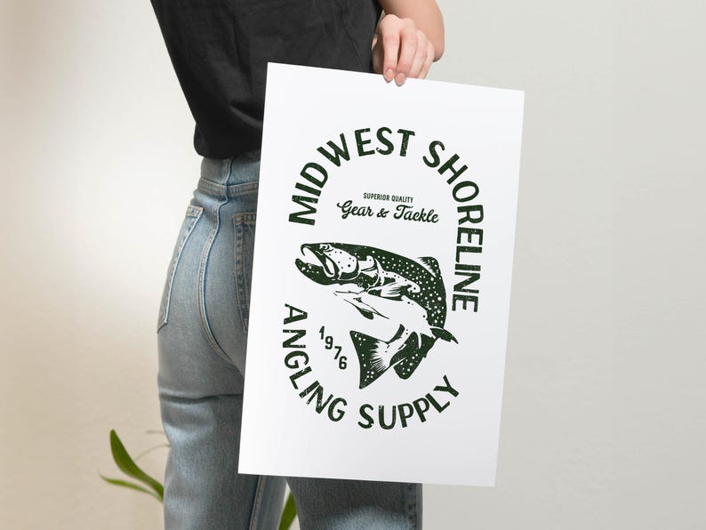 May include: A white poster with a green circle logo that says "Midwest Shoreline Angling Supply" with a black and white illustration of a fish inside the circle. The text "Superior Quality Gear & Tackle" is inside the circle above the fish. The year "1976" is below the fish.