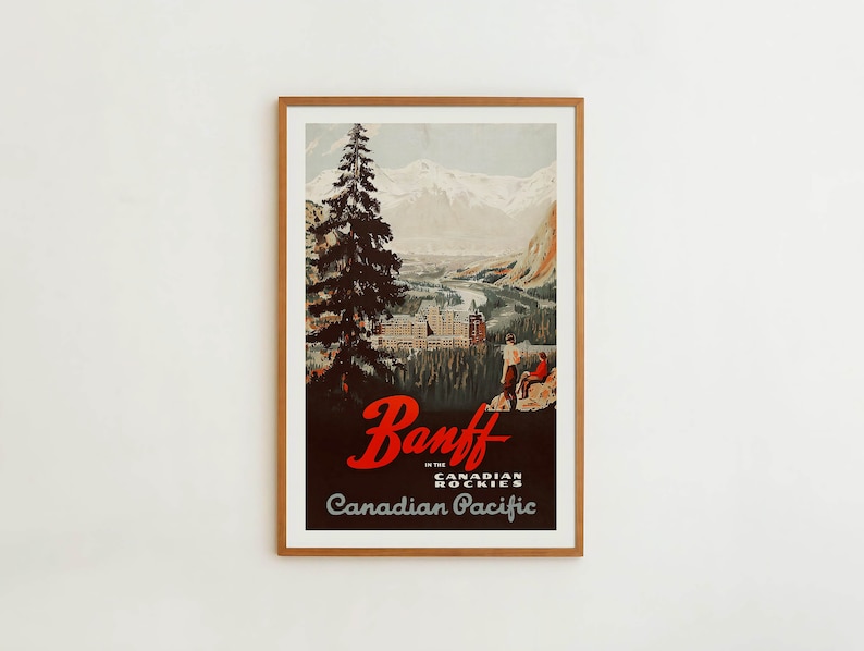 May include: Vintage travel poster advertising Banff in the Canadian Rockies. The poster features a scenic view of a mountain range with a large hotel in the valley below. The text "Banff in the Canadian Rockies" and "Canadian Pacific" are printed in red and black.