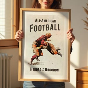 May include: Vintage poster with a red and white illustration of two football players in action. The poster has the text "All-American Football Heroes of the Gridiron".