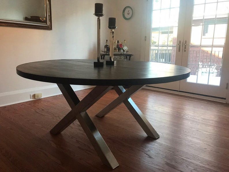 Axis Brushed Stainless Steel X-Frame Table Legs under a dark wood round top