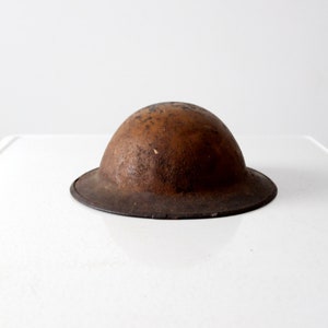 vintage army metal doughboy helmet