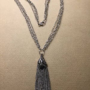 Multi-chain silver tone tassel necklace