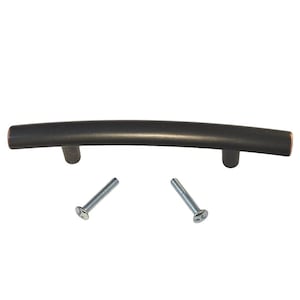 May include: A black curved cabinet pull with two silver screws.
