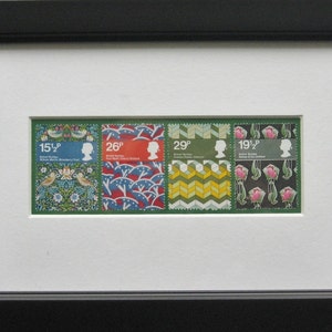 May include: Four British postage stamps featuring different designs. The stamps are green, red, blue, and yellow with a white border. The stamps feature the text "15 1/2p", "26p", "29p", and "19 1/2p".