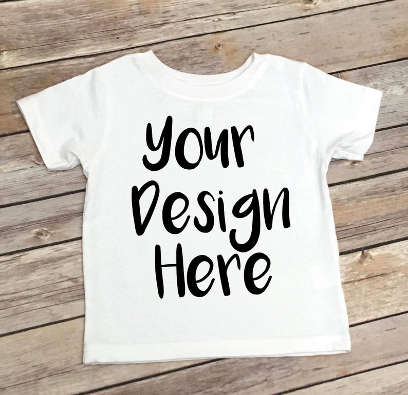 May include: White t-shirt with the text "your design here" in black.
